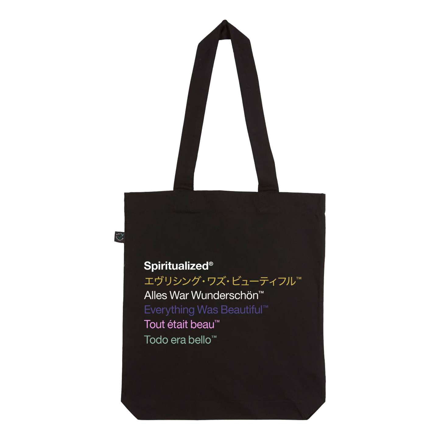 Front view of a black tote bag with the phrase 'Everything Was Beautiful' written in five different languages, each in a different colour.